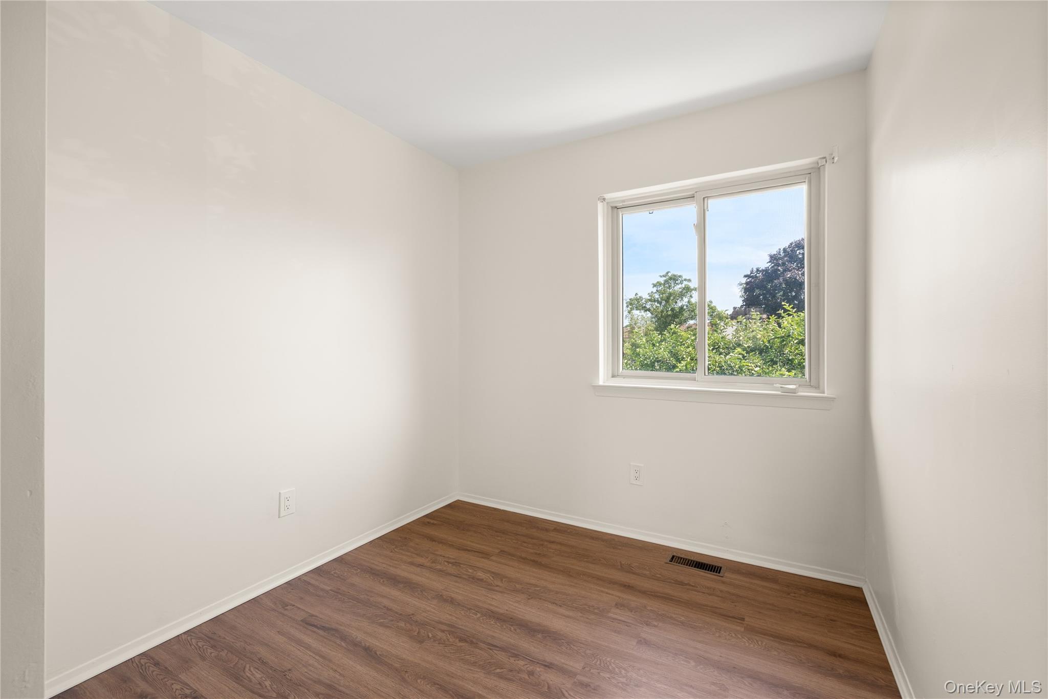 650 Newbridge Road, Unit 15 East Meadow, NY 11554 - Photo 10 of 20 an empty room with a window