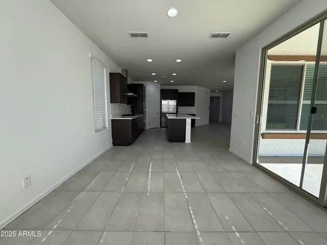 a view of a living room with a kitchen