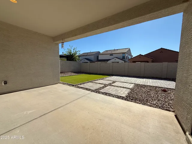 a view of a large tree in front of a house