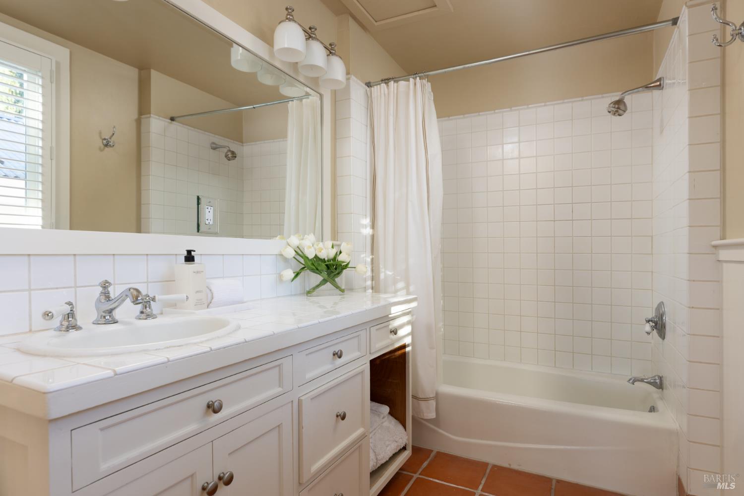 1410 Adams Street St. Helena, CA 94574 - Photo 27 of 46 a bath room with a sink and a mirror
