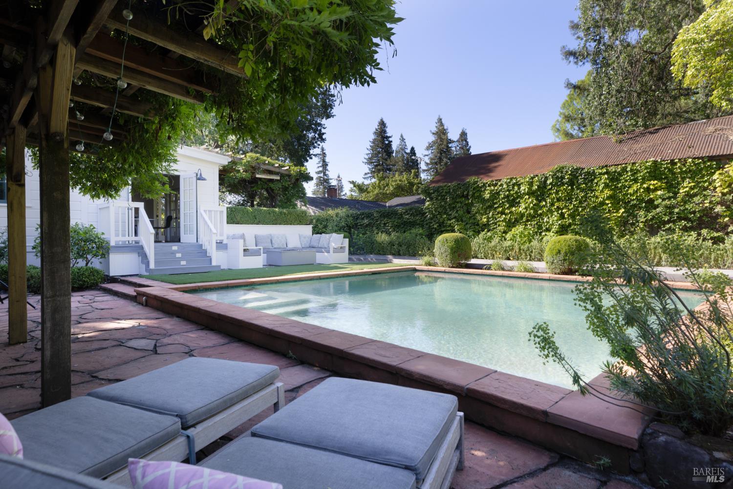 1410 Adams Street St. Helena, CA 94574 - Photo 29 of 46 a view of a swimming pool with a patio