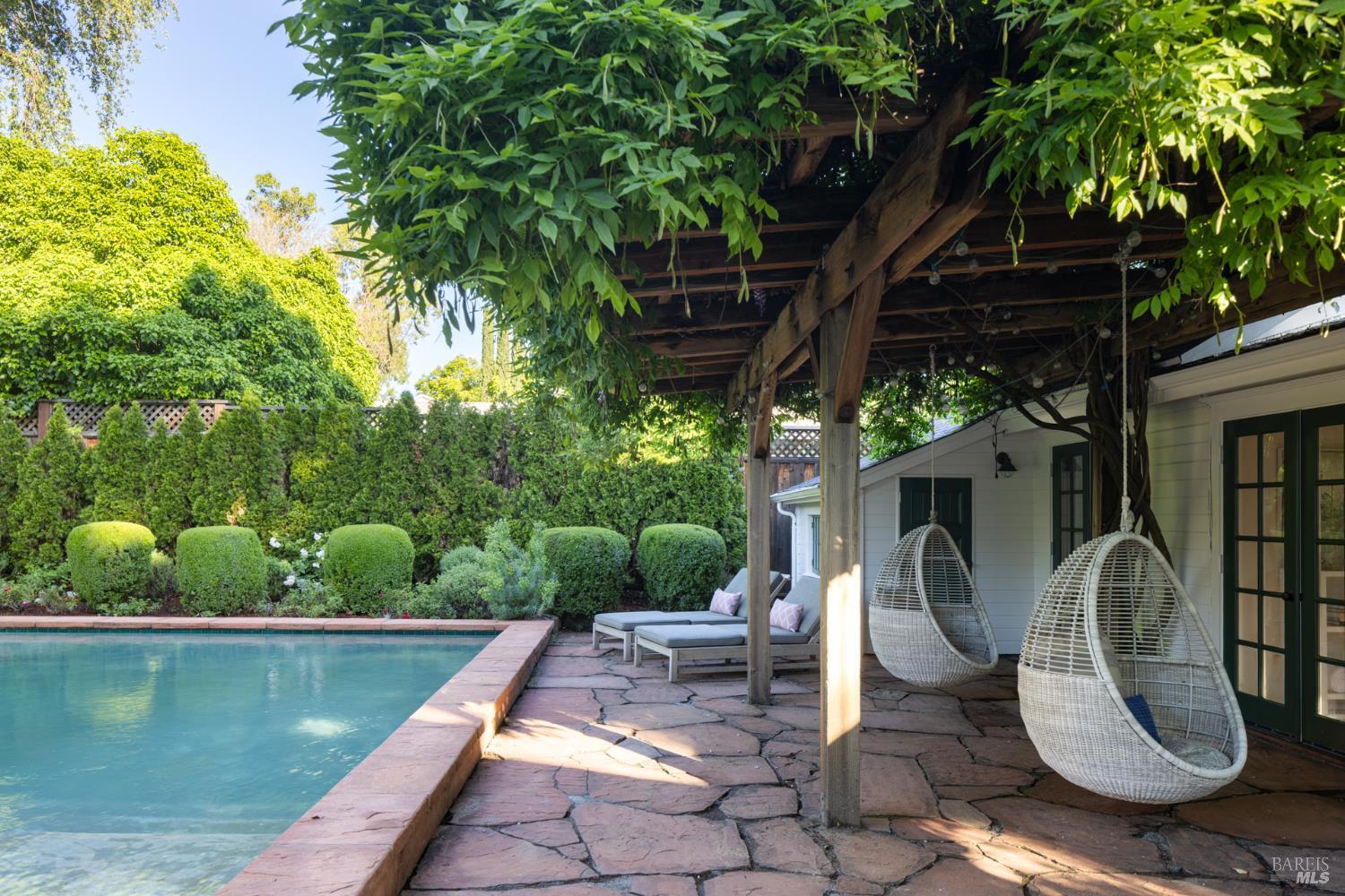 1410 Adams Street St. Helena, CA 94574 - Photo 31 of 46 a view of a swimming pool with lounge chair