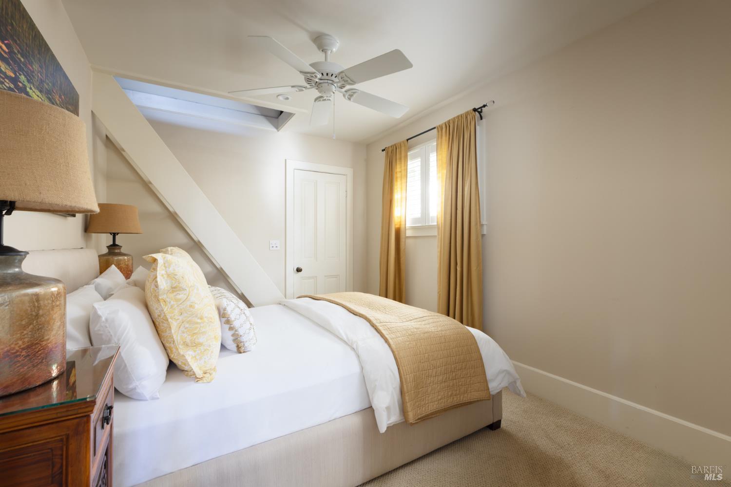 1410 Adams Street St. Helena, CA 94574 - Photo 35 of 46 a bedroom with a bed and a chandelier