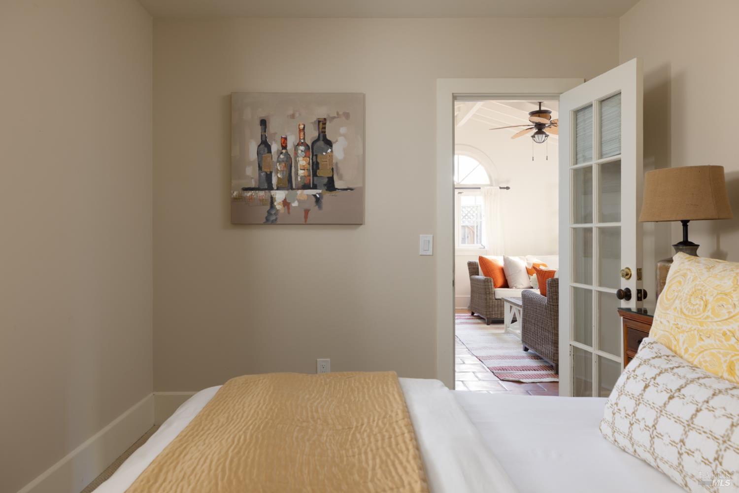 1410 Adams Street St. Helena, CA 94574 - Photo 36 of 46 a bedroom with a bed and a lamp on the dresser