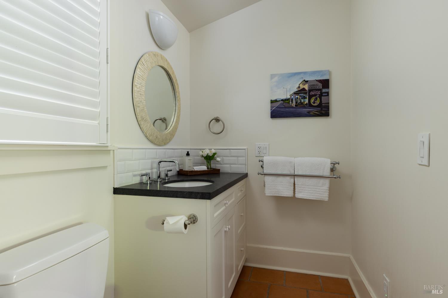 1410 Adams Street St. Helena, CA 94574 - Photo 39 of 46 a bathroom with a sink and a mirror