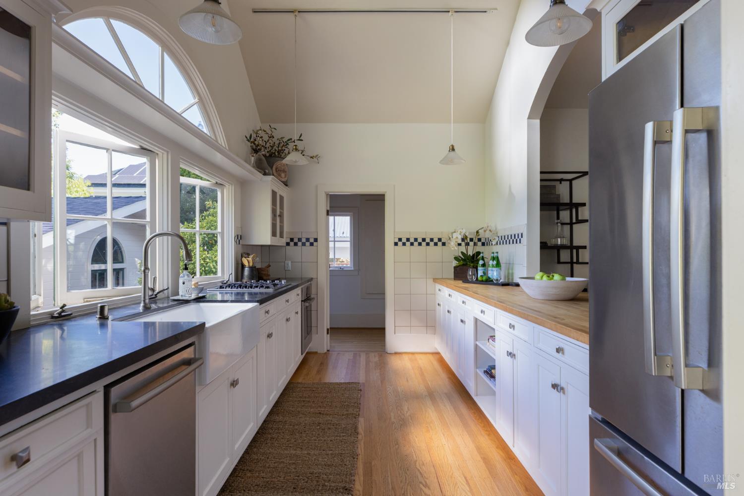 1410 Adams Street St. Helena, CA 94574 - Photo 5 of 46 a large kitchen with a large window and stainless steel appliances