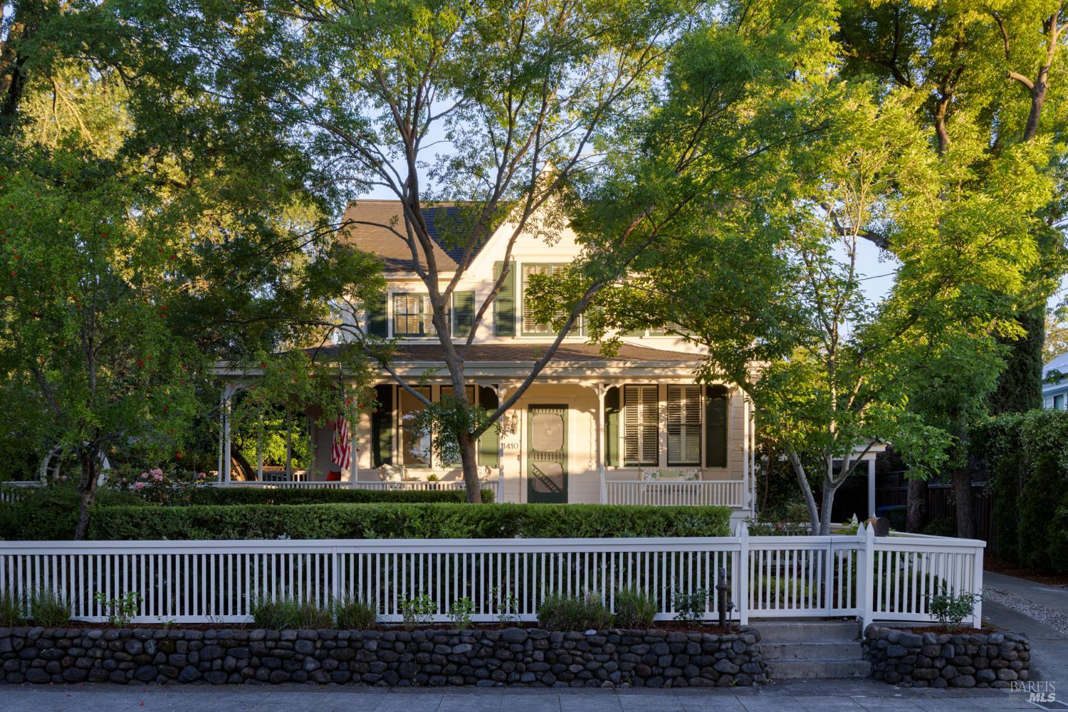1410 Adams Street St. Helena, CA 94574 - Photo 7 of 46 a front view of a house with a garden