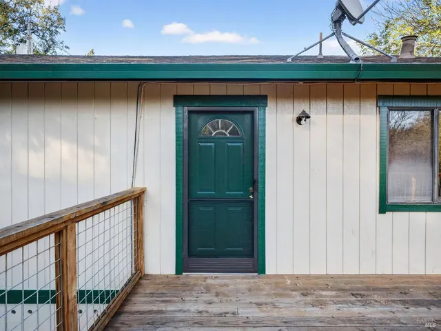 a view of a wooden door in the house