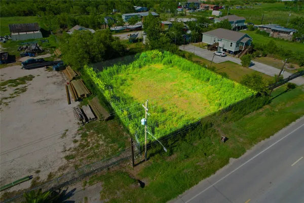 an aerial view of a golf course with parking space