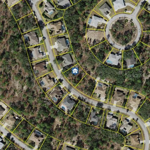 19 Balsam Street Homosassa, FL 34446 - Photo 1 of 4 an aerial view of multiple houses with yard