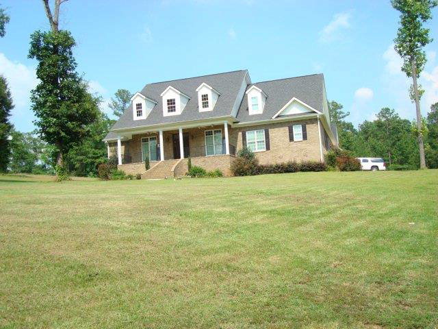 597 Flat Shoals Road Gray, GA 31032 - Photo 1 of 1 a front view of a house with a garden