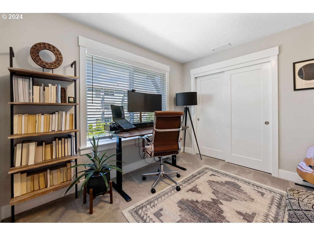 327 South 39th Drive Ridgefield, WA 98642 - Photo 38 of 48 a workspace with furniture bookshelf and a window