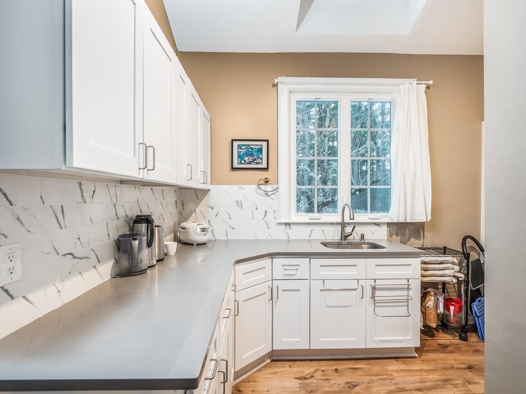 5 Duston Lane Acton, MA 01720 - Photo 15 of 39 a kitchen with stainless steel appliances granite countertop a sink and cabinets