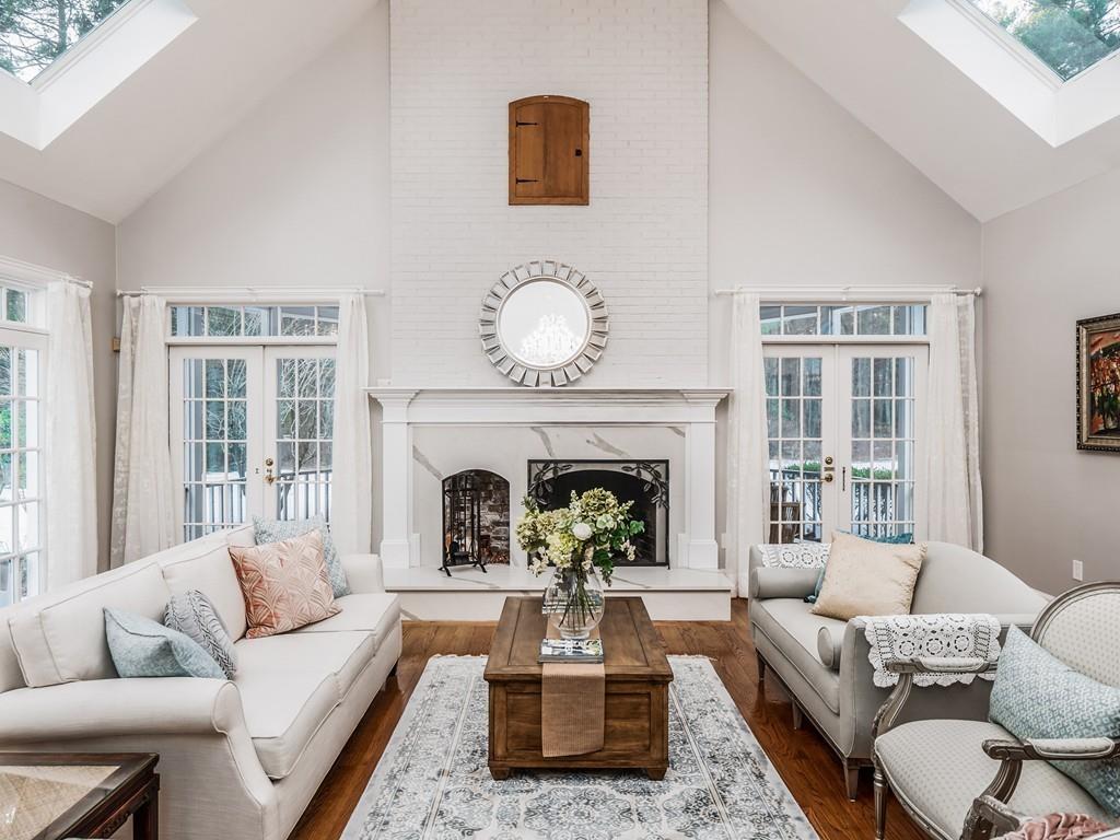 5 Duston Lane Acton, MA 01720 - Photo 16 of 39 a living room with furniture and a fireplace