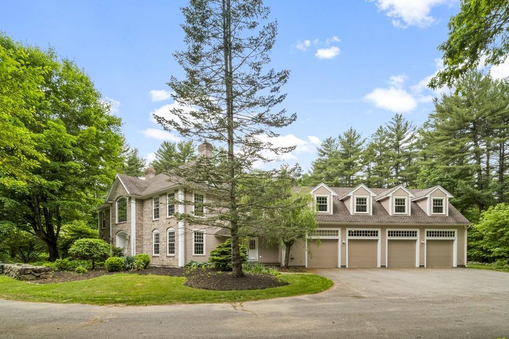 5 Duston Lane Acton, MA 01720 - Photo 2 of 39 a view of a white house with a yard
