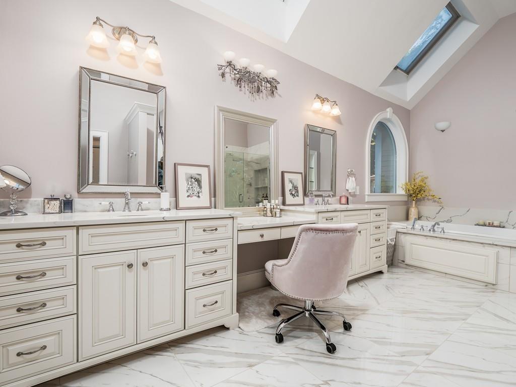 5 Duston Lane Acton, MA 01720 - Photo 23 of 39 a spacious bathroom with a granite countertop sink mirror and bathtub