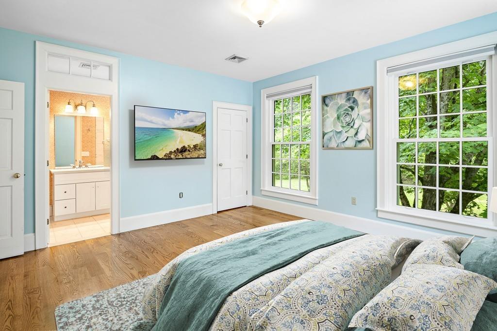 5 Duston Lane Acton, MA 01720 - Photo 25 of 39 a bedroom with a large bed and a window