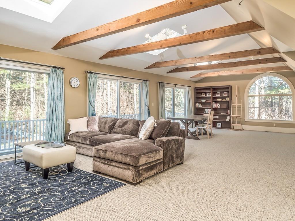 5 Duston Lane Acton, MA 01720 - Photo 30 of 39 a living room with furniture and a large window