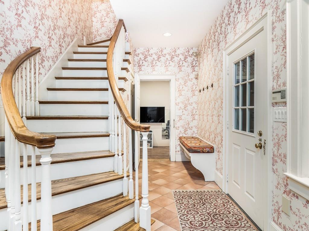 5 Duston Lane Acton, MA 01720 - Photo 31 of 39 a view of an entryway with wooden floor and a front door