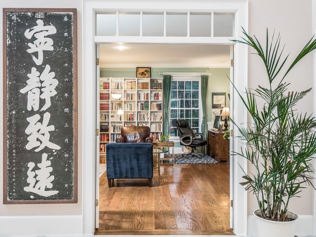 5 Duston Lane Acton, MA 01720 - Photo 5 of 39 a living room with a large window and potted plants