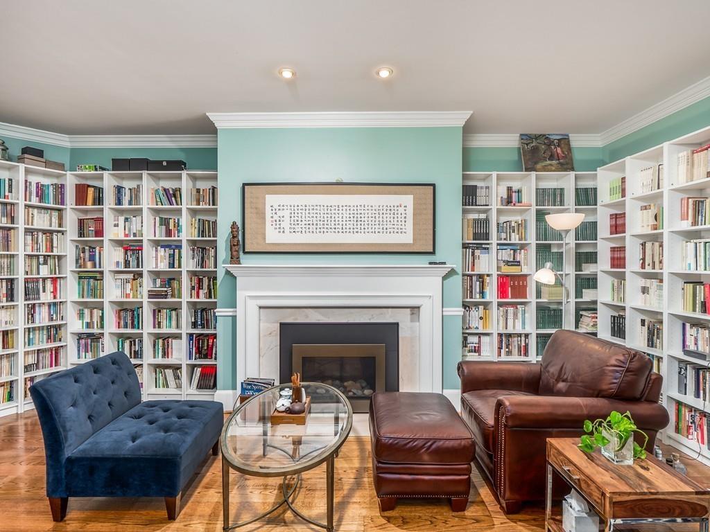 5 Duston Lane Acton, MA 01720 - Photo 6 of 39 a living room with furniture a rug and a fireplace