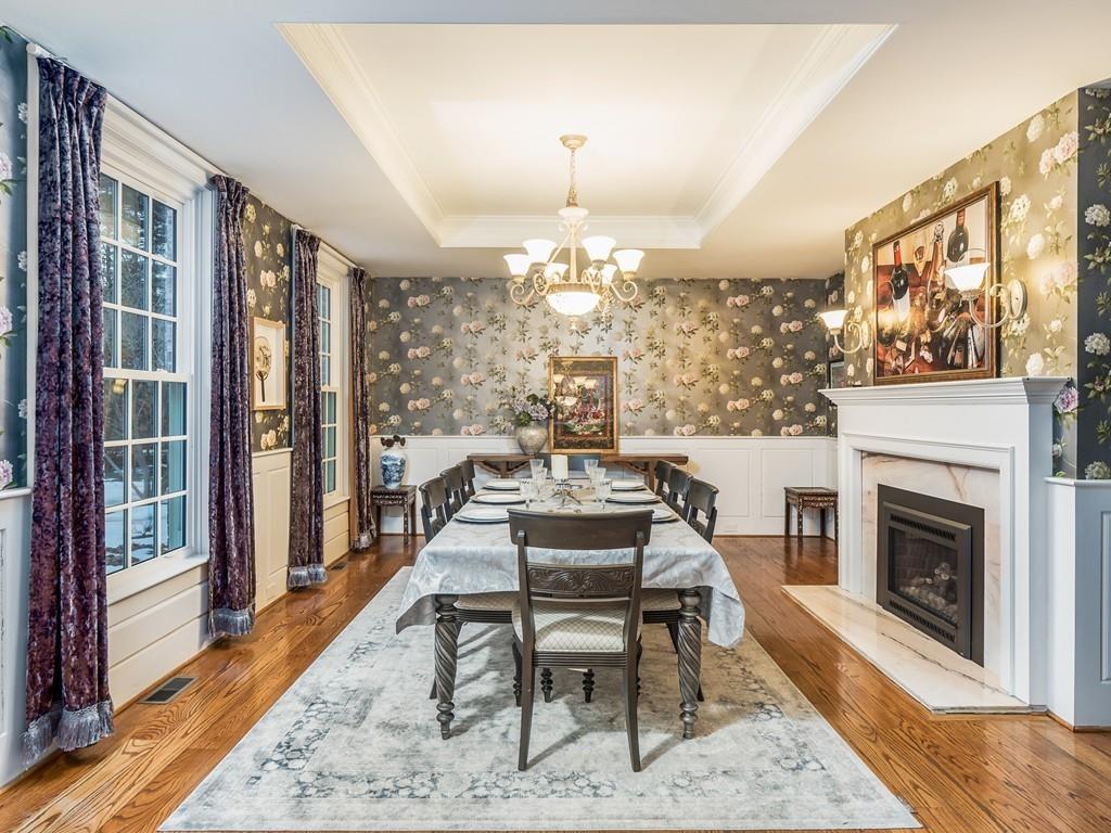 5 Duston Lane Acton, MA 01720 - Photo 8 of 39 a dining room with furniture a fireplace and wooden floor