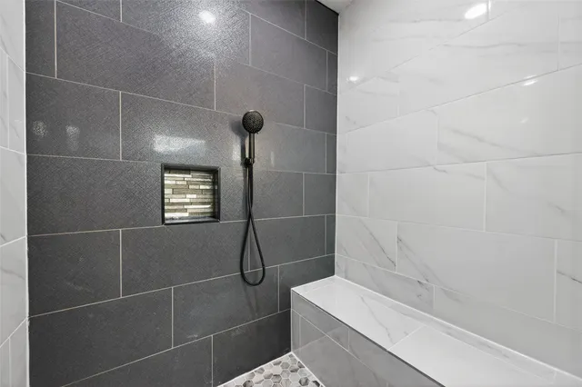 a bathroom with a shower and a toilet
