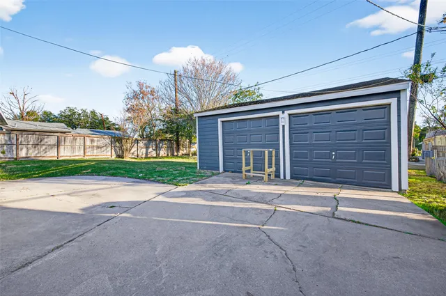 a house with a yard and garage