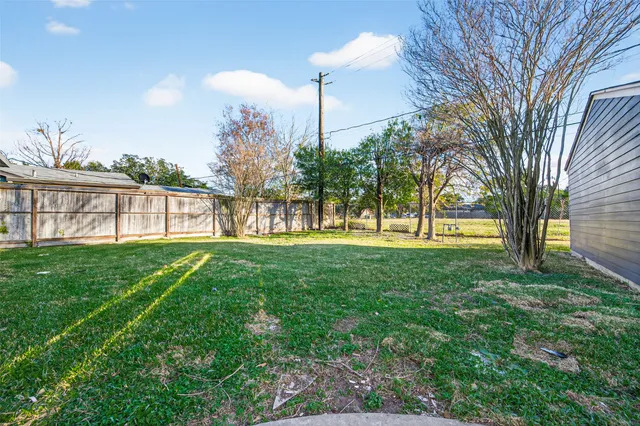 a view of a yard with a tree