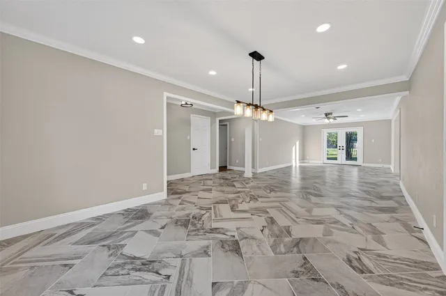 a view of a hallway with a chandelier