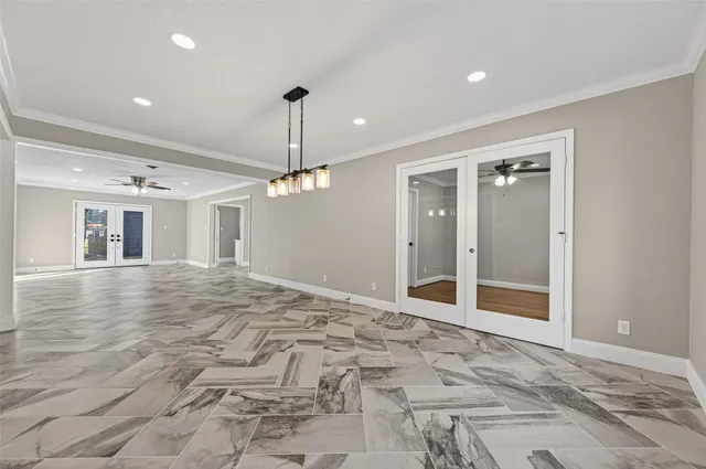 a view of a hallway with a chandelier