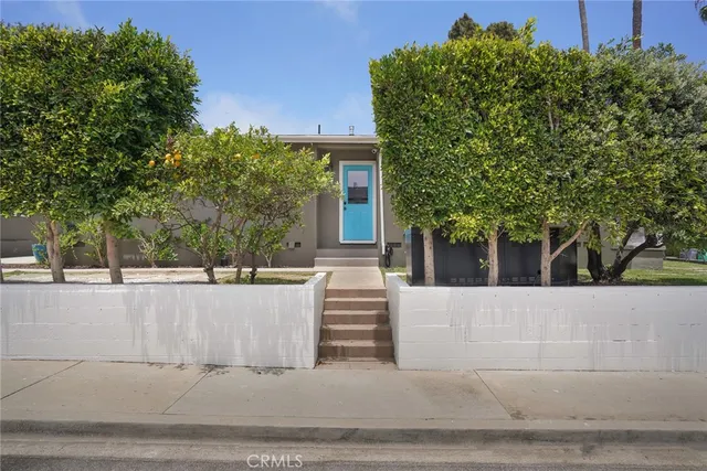 a view of a house with a tree