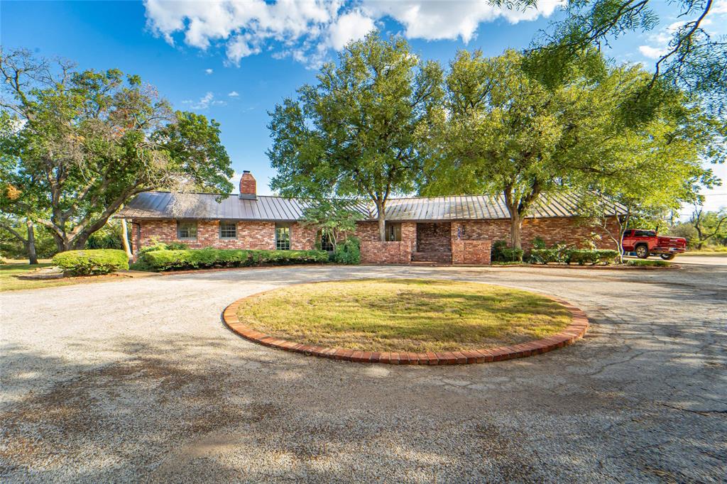 Spacious 4 bed,  3 bath brick home on 4.82 acres with pool and 2-car garage!