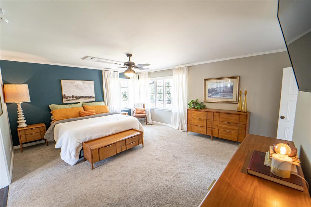 4 Sendero Road Breckenridge, TX 76424 - Photo 17 of 38 Serene and calming! Primary suite offers room for lounge seating and views of the pool and patio area!