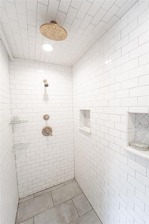 4 Sendero Road Breckenridge, TX 76424 - Photo 19 of 38 Primary bath offers large walk in shower with custom tile and dual shower heads!