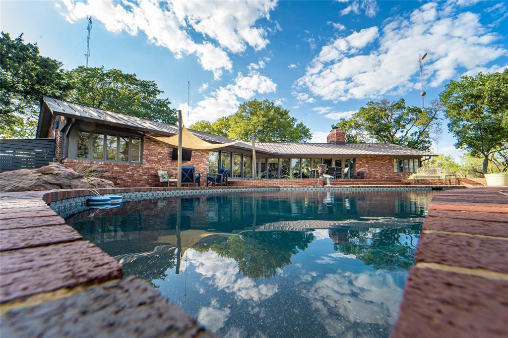 4 Sendero Road Breckenridge, TX 76424 - Photo 30 of 38 Fantastic outdoor living with poolside seating, shade sails and mature shade trees on 4.82 secluded acres!