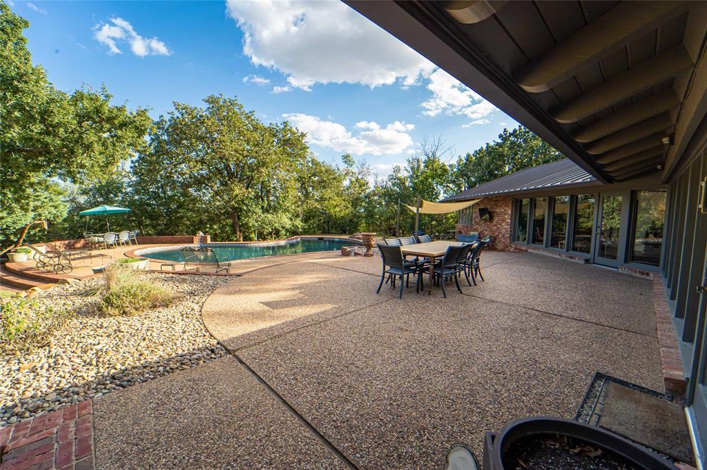 4 Sendero Road Breckenridge, TX 76424 - Photo 32 of 38 Large patio, sparkling pool, shaded sitting areas with open dining space-take in the views from most every room of the property!
