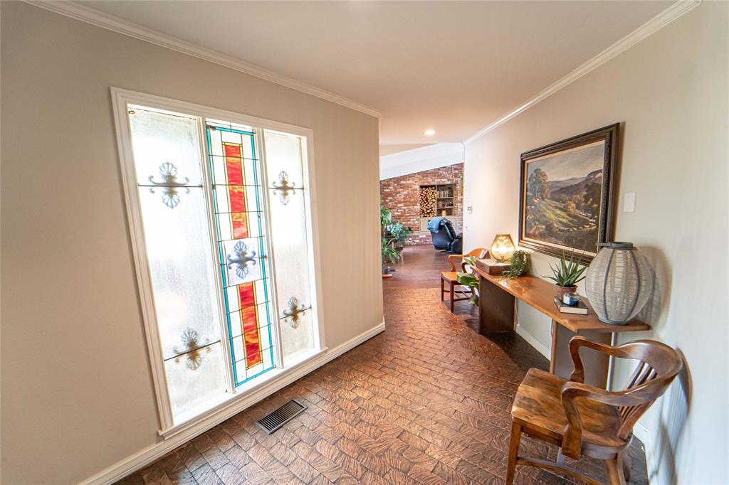4 Sendero Road Breckenridge, TX 76424 - Photo 4 of 38 Corridor with brick flooring and ornamental molding