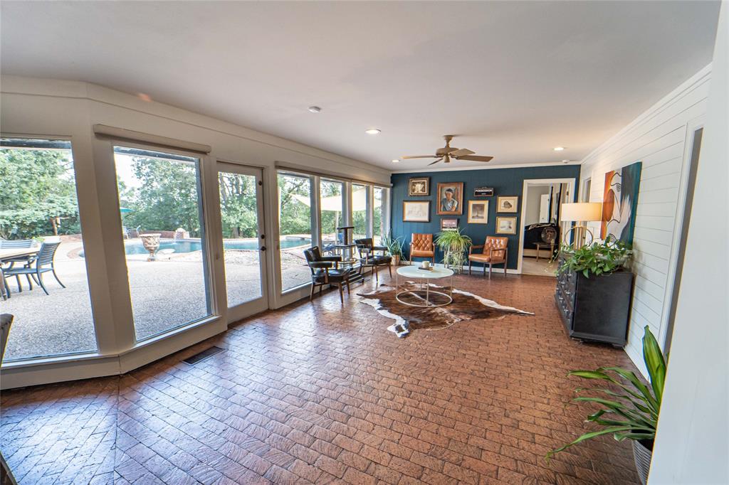 4 Sendero Road Breckenridge, TX 76424 - Photo 9 of 38 Second Living Area, adjacent to dining and kitchen area-light filled, unique brick flooring and overlooking the backyard oasis!