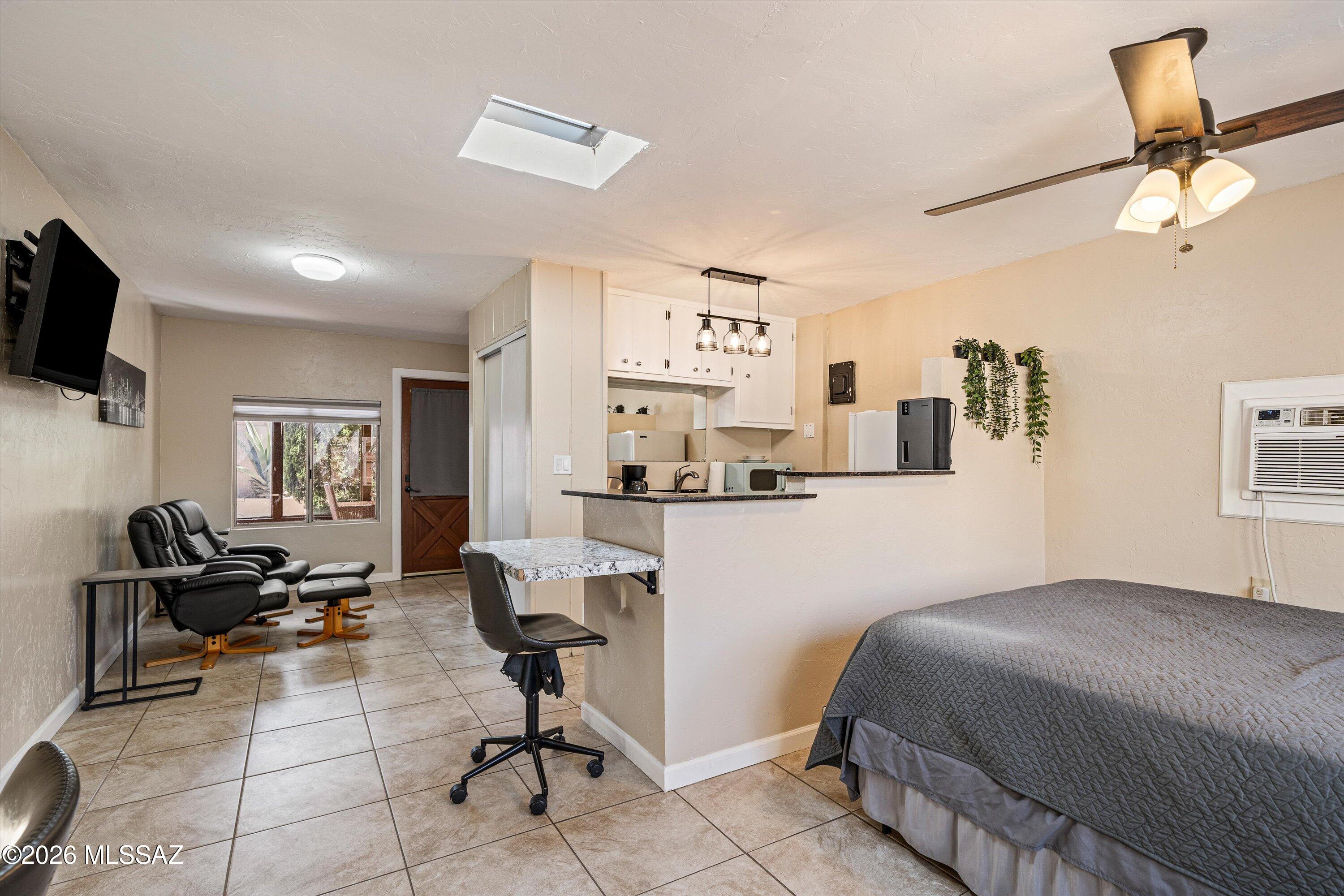 2619 East Prince Road Tucson, AZ 85716 - Photo 30 of 50 a workspace with a couch
