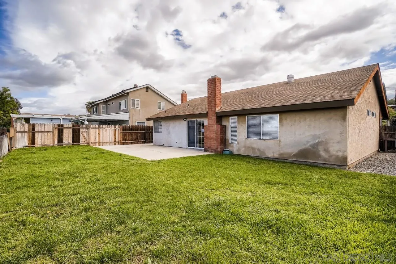 528 Kempton Street Spring Valley, CA 91977 - Photo 23 of 27 a backyard of a house with lots of green space