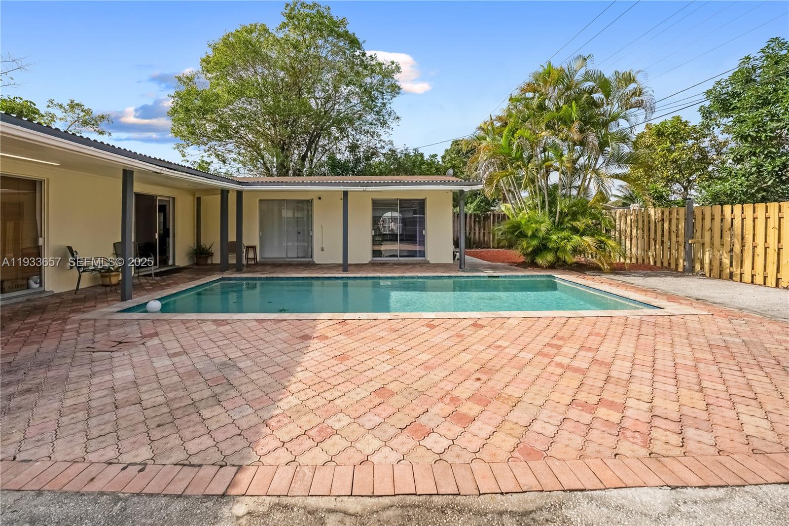 6841 Raleigh Street Hollywood, FL 33024 - Photo 22 of 41 a view of backyard with outdoor seating