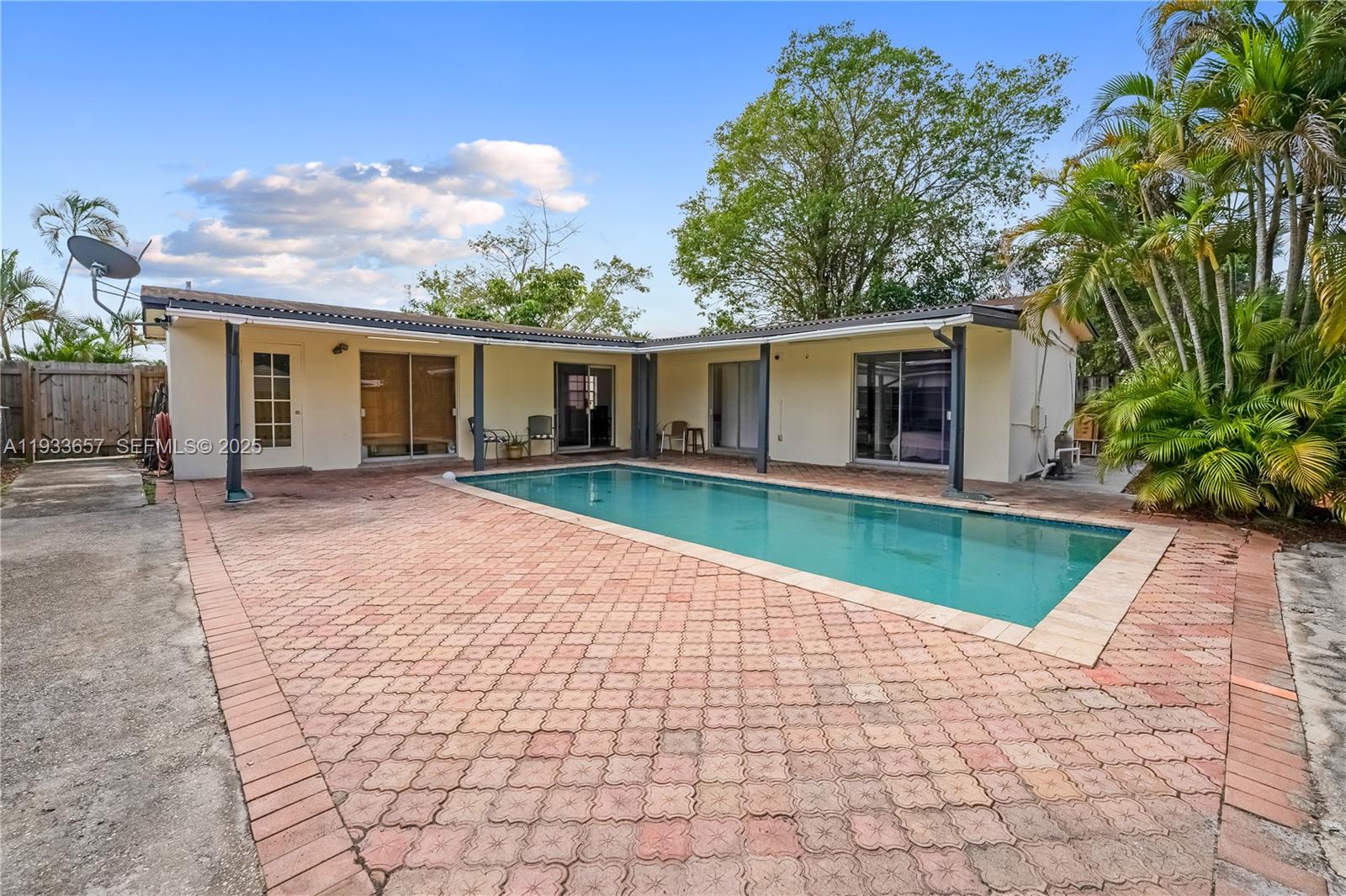 6841 Raleigh Street Hollywood, FL 33024 - Photo 25 of 41 a front view of house with yard and green space