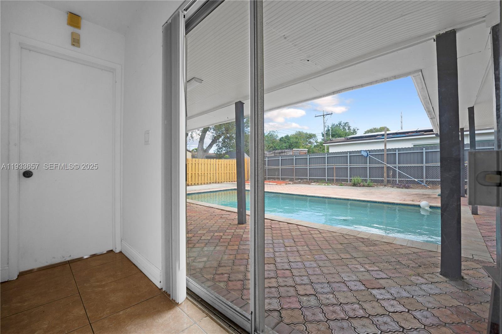 6841 Raleigh Street Hollywood, FL 33024 - Photo 26 of 41 a view of a glass door and the balcony