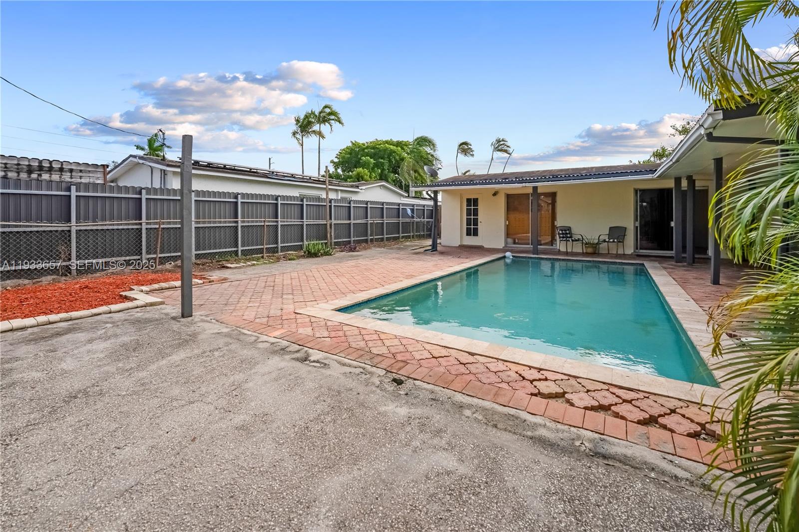 6841 Raleigh Street Hollywood, FL 33024 - Photo 30 of 41 a view of a house with backyard and sitting area
