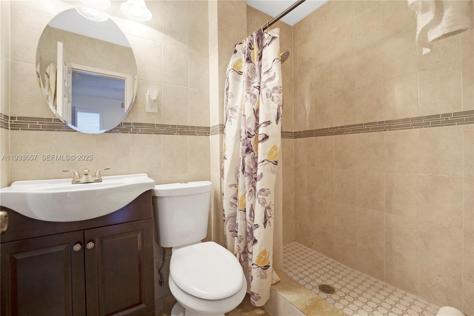 6841 Raleigh Street Hollywood, FL 33024 - Photo 31 of 41 a bathroom with a sink toilet and shower