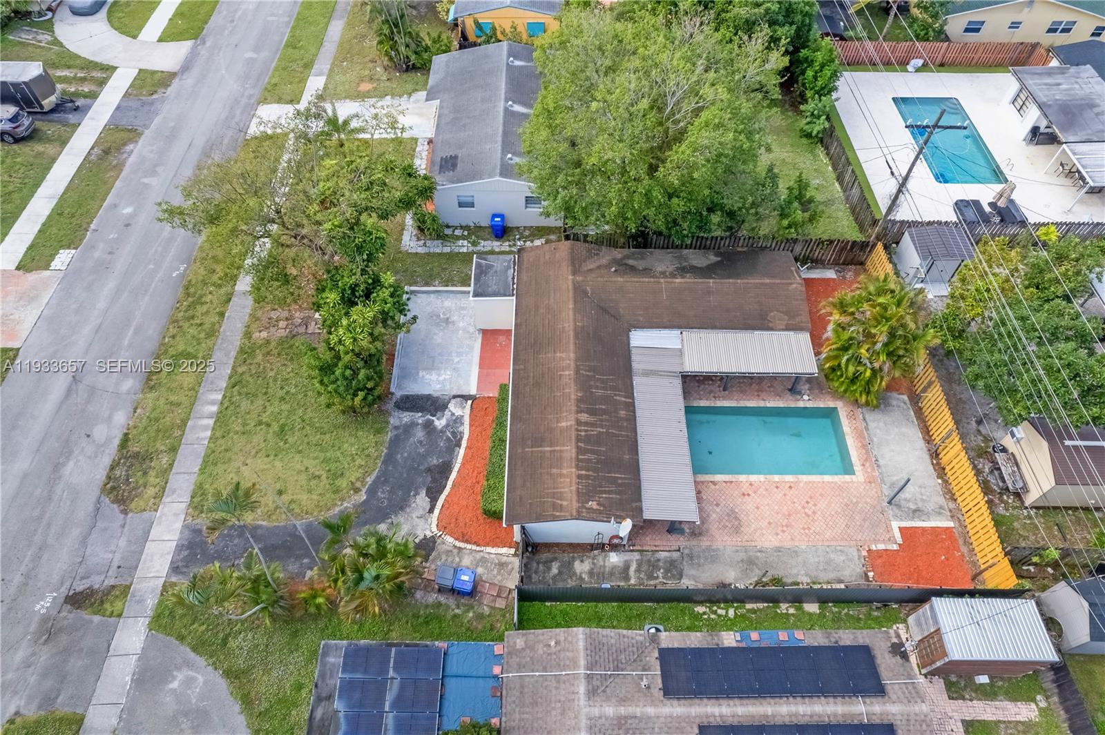 6841 Raleigh Street Hollywood, FL 33024 - Photo 38 of 41 an aerial view of a house with a yard and potted plants