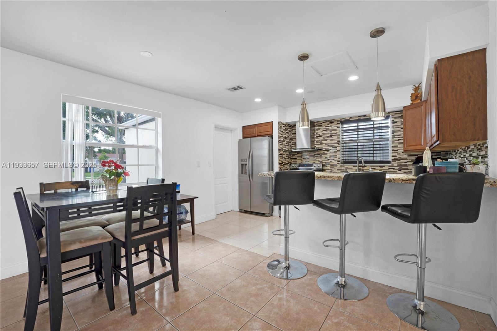 6841 Raleigh Street Hollywood, FL 33024 - Photo 7 of 41 a view of a dining room with furniture