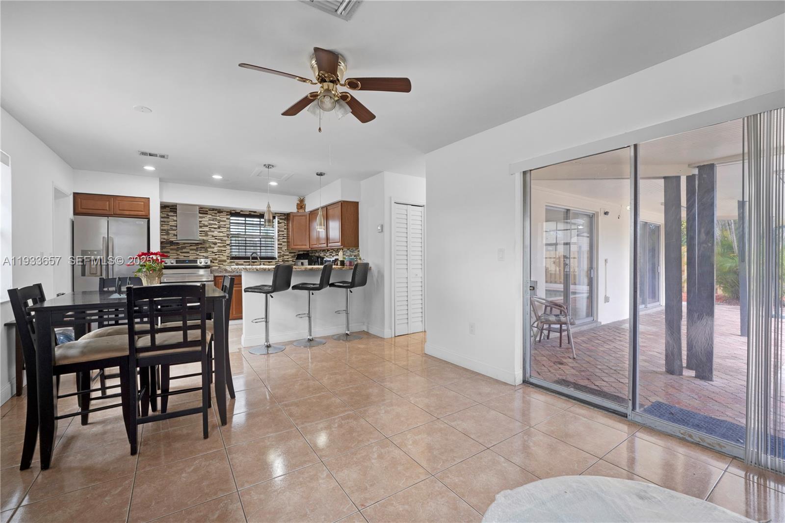 6841 Raleigh Street Hollywood, FL 33024 - Photo 8 of 41 a view of kitchen with furniture and windows