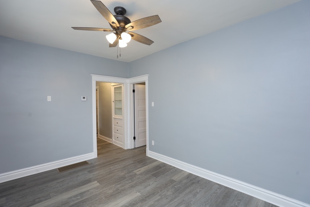 2039 West 23rd Street, Unit 1 Chicago, IL 60608 - Photo 13 of 20 a view of an empty room with a fan